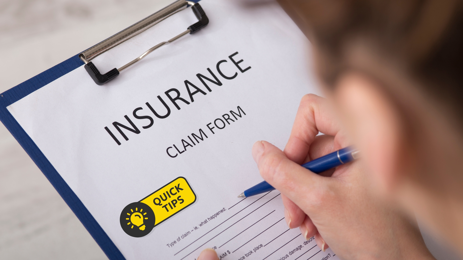 Insurance agent filling car insurance claim form at Complete Insurance Hub
