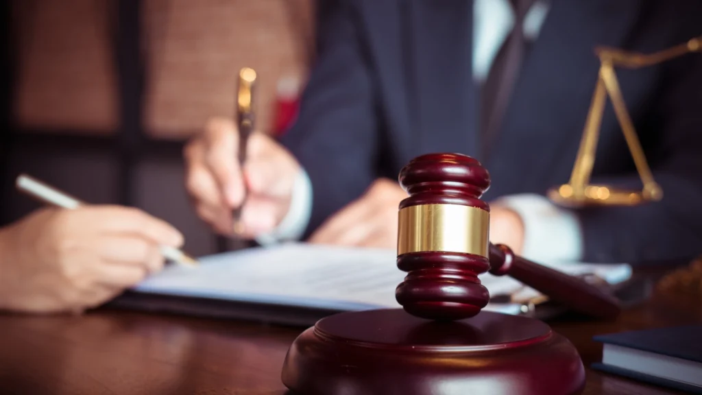 Legal consultation scene with gavel and attorney, representing car accident attorney no insurance support