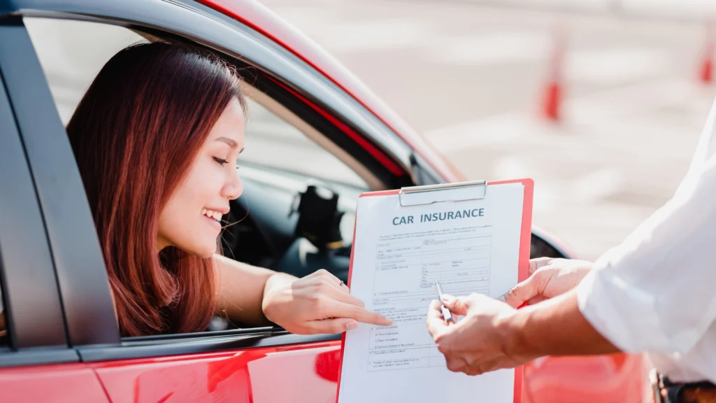 A woman in a red car reviews a clipboard with a Car Insurance Template form handed to her by another person.