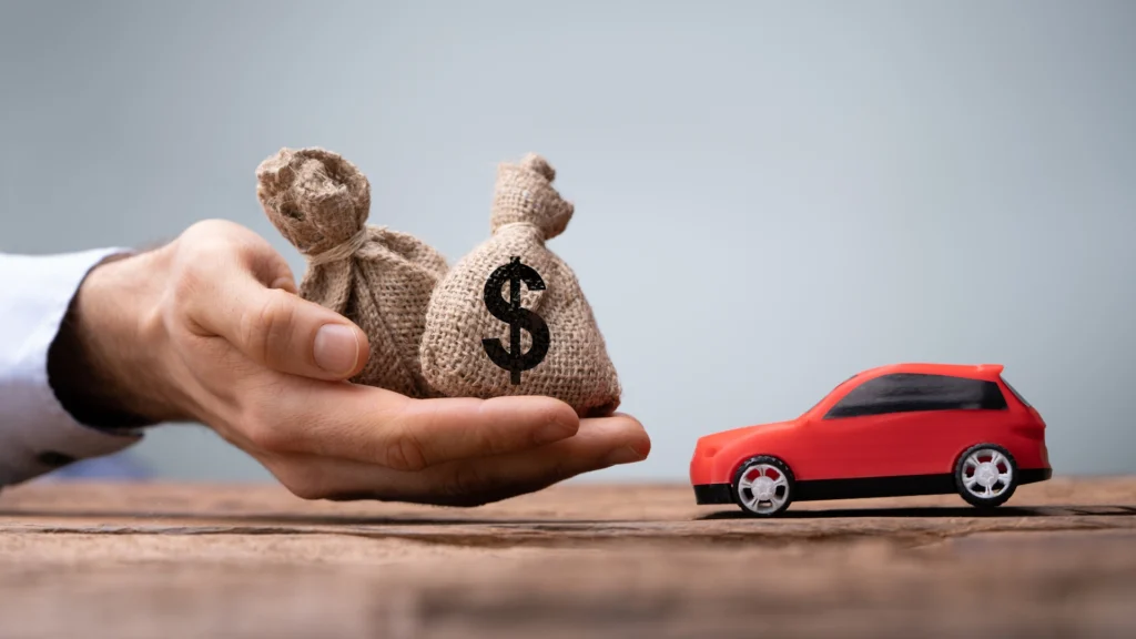 Insurance payout in hand next to car what happens if you don't use insurance money for repairs