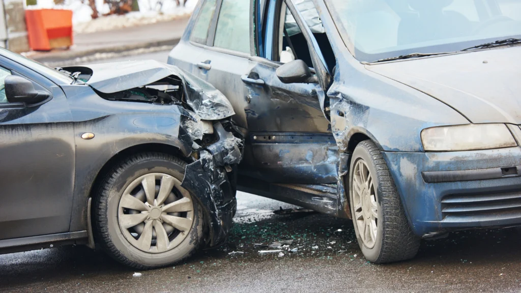 Front-end collision damage illustrates the need for luxury vs standard accident coverage decisions.