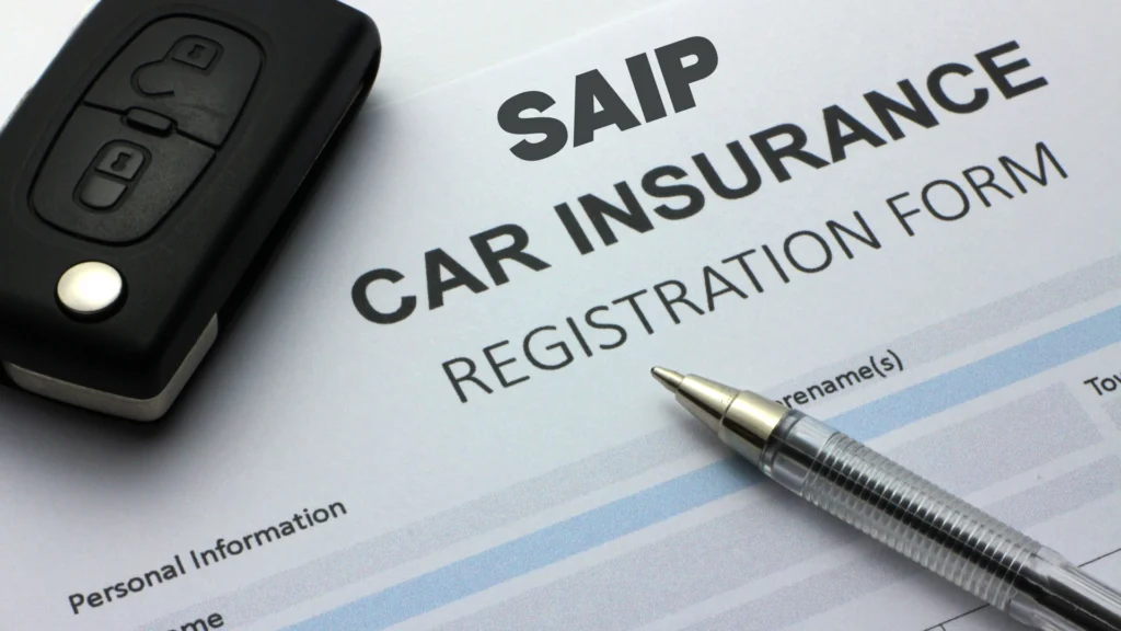 SAIP program auto insurance registration document with key and pen.