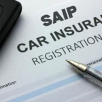 SAIP program auto insurance registration document with key and pen.